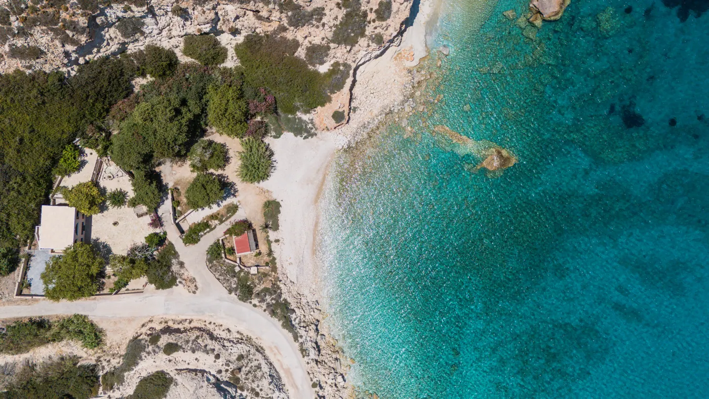 Aerial view of the turquoise bay beside Platani Seaside Villa